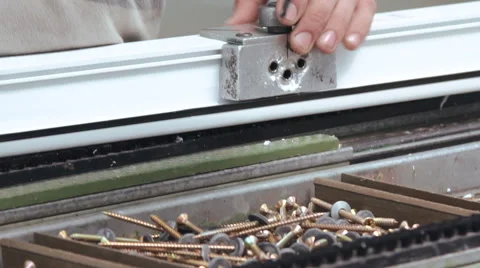 Worker makes windows on the windows factory Video stock 68655440