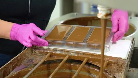 Worker making chocolate bars in industrial kitchen Stock Footage 300530454