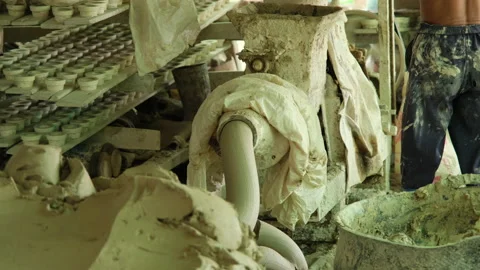 Worker making clay objects in pottery workshop. The process of kneading the clay Video stock 194531298