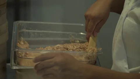 Worker making dumplings. Close up. Slow motion.  Video stock 78885075