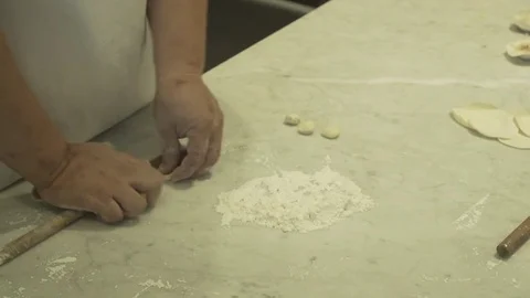 Worker making dumplings with hands. Slow motion.  Video stock 78884154