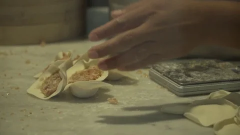 Worker making dumplings. Slow motion. Close up.  Video stock 78884388