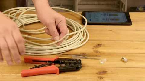 Worker Making a Network Cable for Internet Connection, Technician Stock Footage 129943875