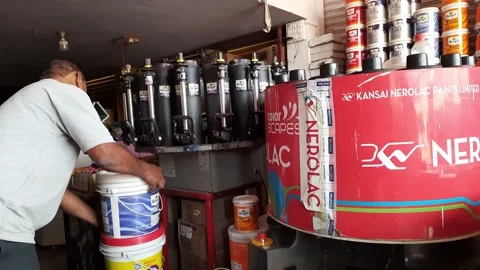 A worker making a new color scale by mix... | Stock Video | Pond5