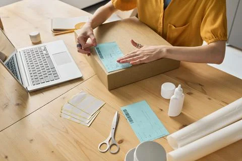 Worker making out parcel for delivery 스톡 사진