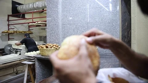 Worker making pita bread with modern industrial machinery in Arabian bakery Stock Footage 166034352