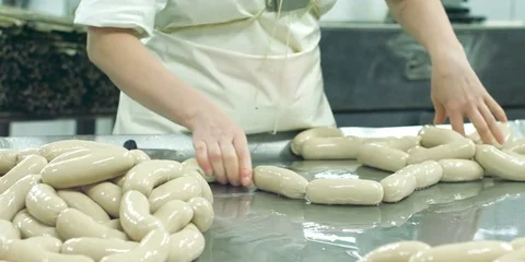 A worker is making sausages by hand Stock Footage 73803650