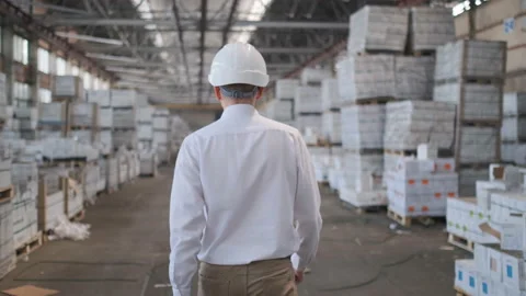 Worker male warehouse worker engineer man in a helmet working on the Stock Footage 114443733