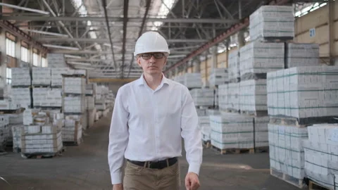 Worker male warehouse worker engineer man in a helmet working on the Stock Footage 114444035