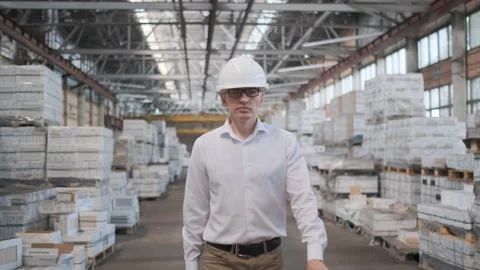 Worker male warehouse worker engineer man in a helmet working on the Video stock 114447905