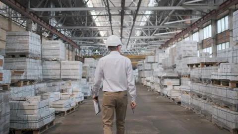 Worker male warehouse worker engineer man in a helmet working on the Video stock 114448493