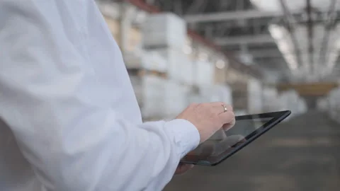 Worker male warehouse worker engineer man in a helmet working on the Video stock 114451275