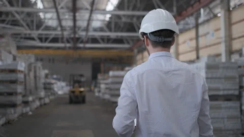 Worker male warehouse worker engineer man in a helmet working on the Video stock 114452220