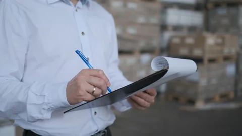 Worker male warehouse worker engineer man in a helmet working on the Video stock 114452585