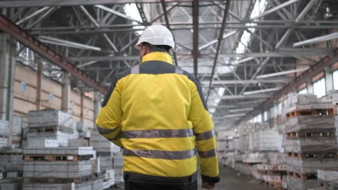 Worker male warehouse worker engineer man in a helmet working on the Stock Footage 114472816