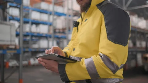 Worker male warehouse worker engineer man in a helmet working on the Stock Footage 114474074