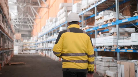 Worker male warehouse worker engineer man in a helmet working on the Stock Footage 114474475