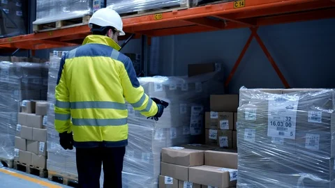 Worker male warehouse worker engineer man in a helmet working on the Stock Footage 127942391