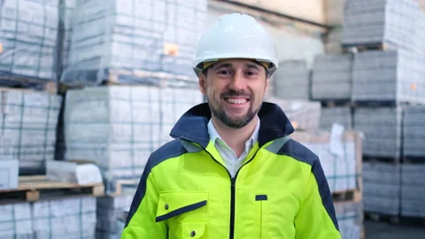 Worker male warehouse worker engineer man in a helmet working on the Stock Footage 147407076