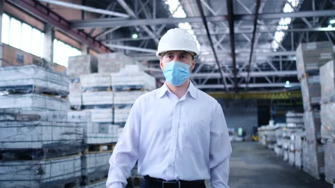 Worker male warehouse worker engineer man in a helmet working on the Stock Footage 147407924