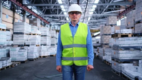 Worker male warehouse worker engineer man in a helmet working on the Stock Footage 147408763
