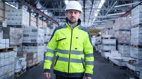 Worker male warehouse worker engineer man in a helmet working on the Stock Footage 147410315