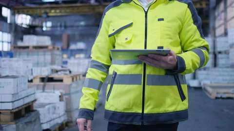 Worker male warehouse worker engineer man in a helmet working on the Stock Footage 147635805