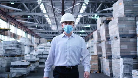 Worker male warehouse worker engineer man in a helmet working on the Stock Footage 147636063