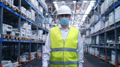 Worker male warehouse worker engineer man in a helmet working on the Stock Footage 148163191