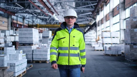 Worker male warehouse worker engineer man in a helmet working on the Stock Footage 157901725