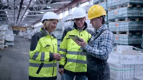 Worker male warehouse worker engineer man in a helmet working on the Stock Footage 172167762