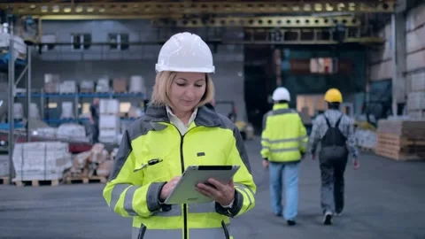 Worker male warehouse worker engineer man in a helmet working on the Stock Footage 172167852