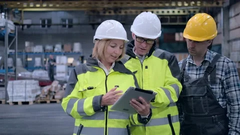 Worker male warehouse worker engineer man in a helmet working on the Stock Footage 172167866