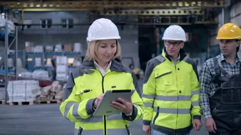 Worker male warehouse worker engineer man in a helmet working on the Stock Footage 172167867