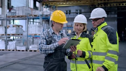 Worker male warehouse worker engineer man in a helmet working on the Stock Footage 172167919
