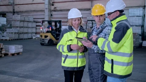 Worker male warehouse worker engineer man in a helmet working on the Stock Footage 172167974