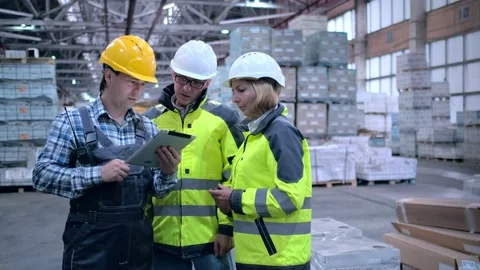 Worker male warehouse worker engineer man in a helmet working on the Stock Footage 172168007
