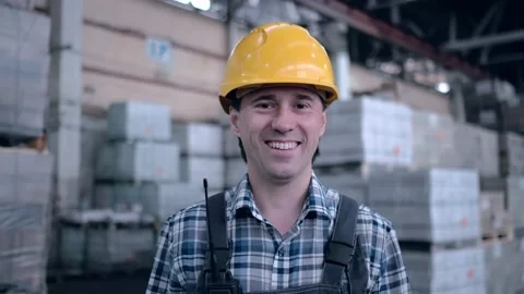 Worker male warehouse worker engineer man in a helmet working on the Stock Footage 172168304