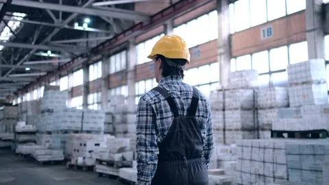 Worker male warehouse worker engineer man in a helmet working on the Stock Footage 172168318