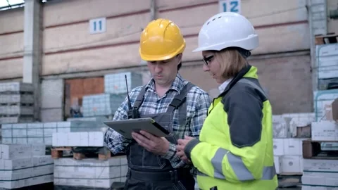Worker male warehouse worker engineer man in a helmet working on the Stock Footage 172168336
