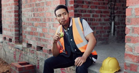 Worker, man and thinking at construction site with lunch break, building project Stock Footage 336261178