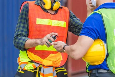 Worker man checking fever by digital thermometer for scan and protect Stock Photos
