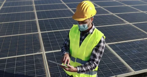 Worker man with digital tablet  wearing safety mask inside wind farm Stock Footage 149302496