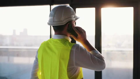 Worker Man Engineer Walking at Modern Unfinished Business Center. Male Civil Stock Footage 234082690