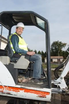 Worker man on Forklift Looking at Camera Stock Photos