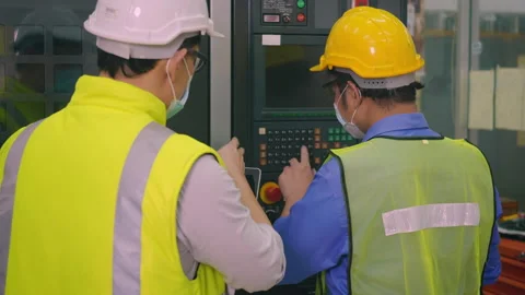 Worker man operating automated programming CNC milling control machine 動画素材 149166229