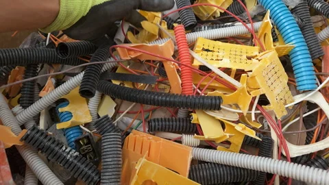 Worker man separate industrial plastic waste debris before recycling, waste 4k Stock Footage 345247814