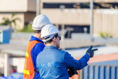 Worker man team checking control loading containers box from cargo Фото