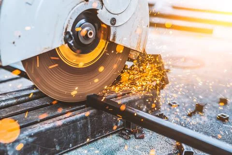 Worker man using machine cutting steel Stock Photos