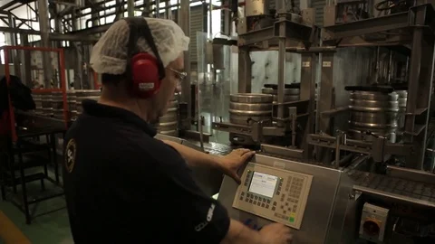 Worker manning beer keg line Stock Footage 77045190